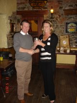 A proud Joan Sinnott receives the most improved golfer trophy