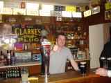 It's a thumbs up from behind the bar