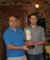Andrew Lacey presents the Martin Lacey perpetual Trophy to the clubman of the year PJ Naughter